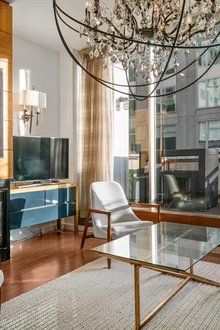 a living room with couch and a flat screen tv