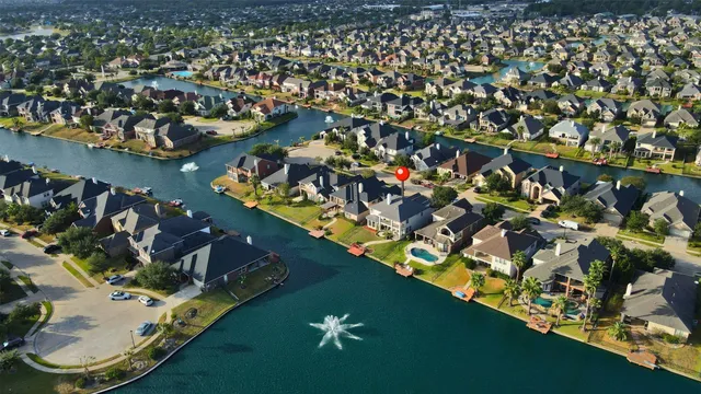 an aerial view of a house with a swimming pool