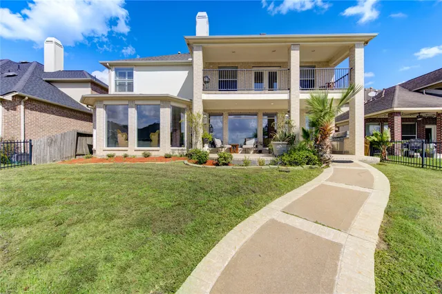 a front view of a house with a yard table and chairs
