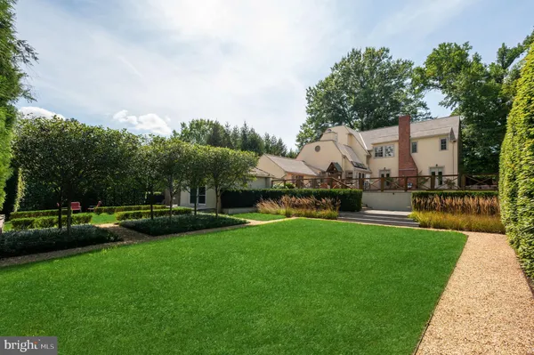 a view of a garden with houses