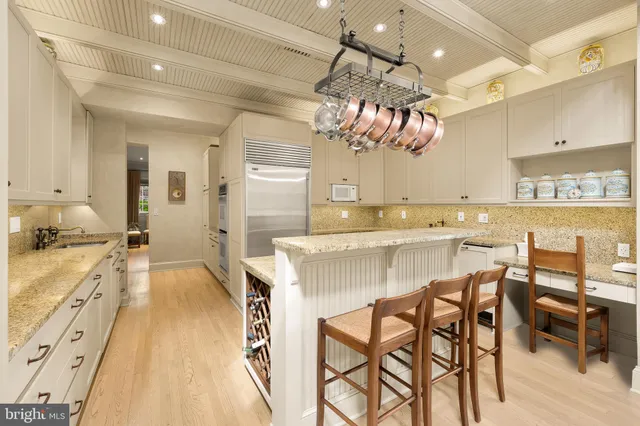 a kitchen with a table and chairs in it