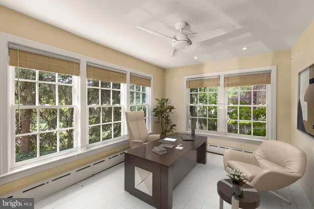 a living room with furniture and windows