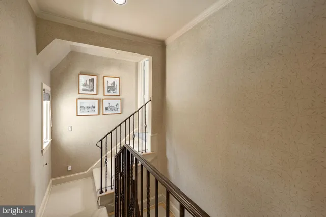 a view of a hallway with wooden floor and entryway