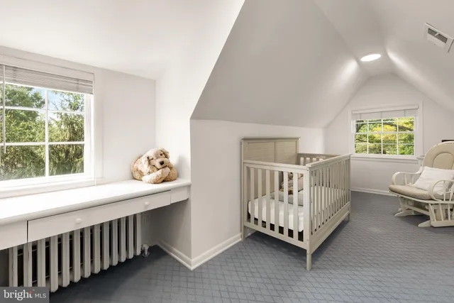 a bedroom with furniture and windows