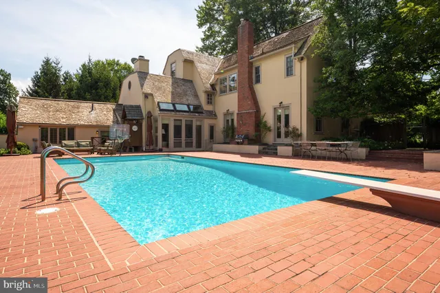 a view of a house with a swimming pool