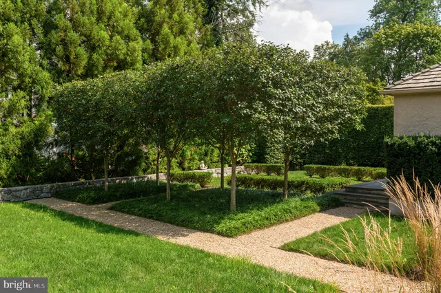 a view of a backyard with sitting area