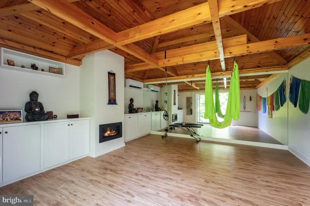 a view of a livingroom with a patio and a fireplace