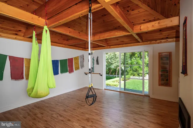 a view of outdoor space with wooden deck and furniture
