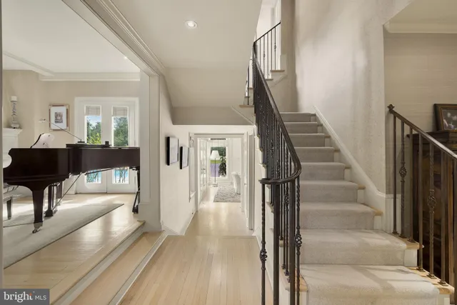 a view of a hallway view with wooden floor and staircase