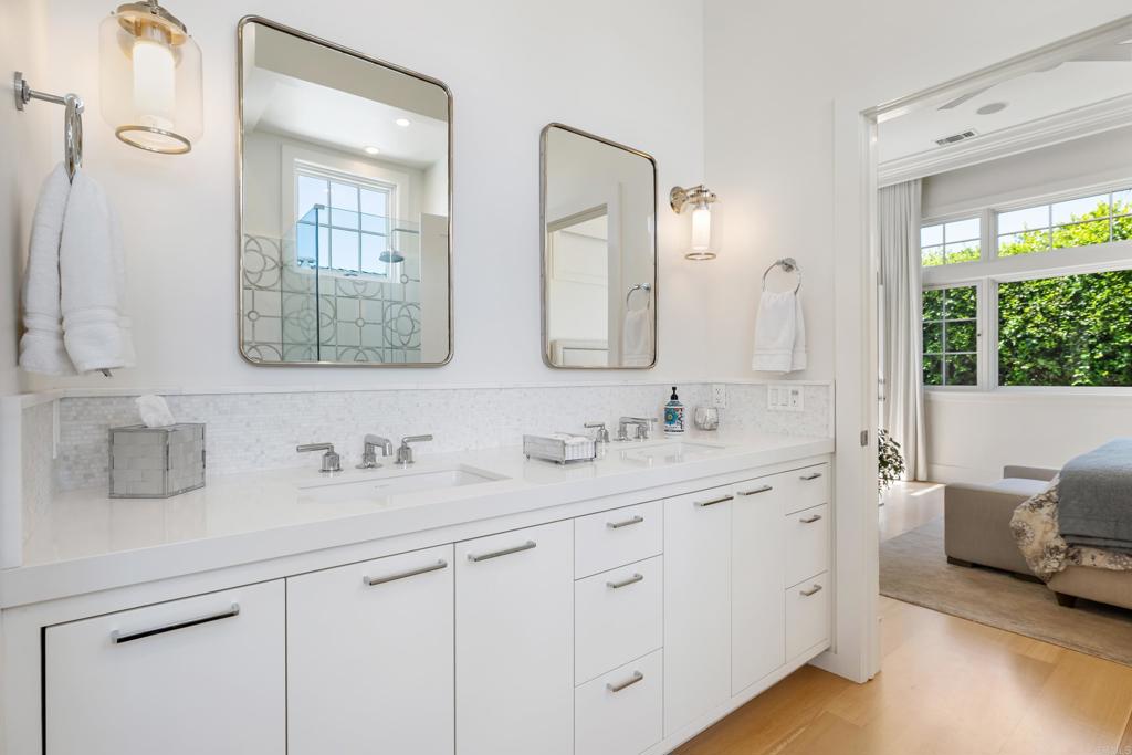 236 24th Street Del Mar, CA 92014 - Photo 19 of 44 a bathroom with double vanity sink a mirror and a shower