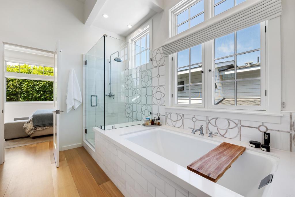 236 24th Street Del Mar, CA 92014 - Photo 20 of 44 a spacious bathroom with a tub double sink and glass door