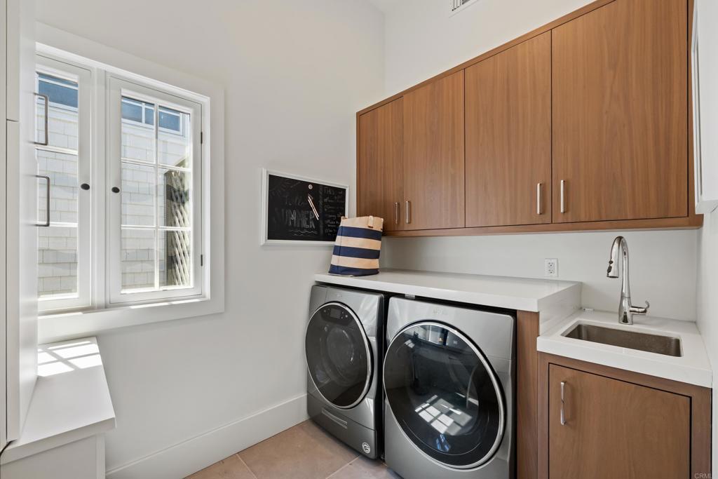 236 24th Street Del Mar, CA 92014 - Photo 26 of 44 a utility room with sink dryer and washer