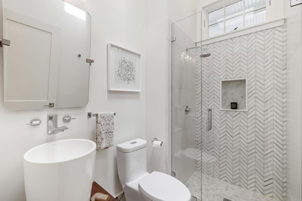 236 24th Street Del Mar, CA 92014 - Photo 27 of 44 a bathroom with a toilet sink shower and mirror