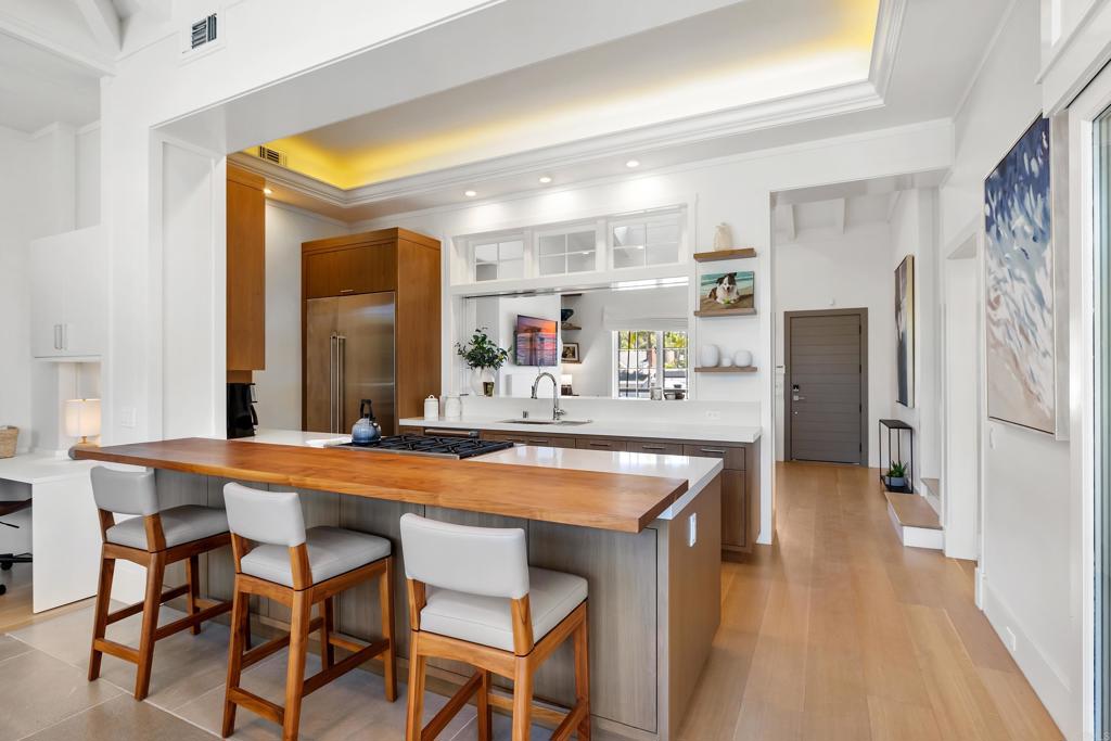 236 24th Street Del Mar, CA 92014 - Photo 5 of 44 a dining hall with stainless steel appliances a table and chairs