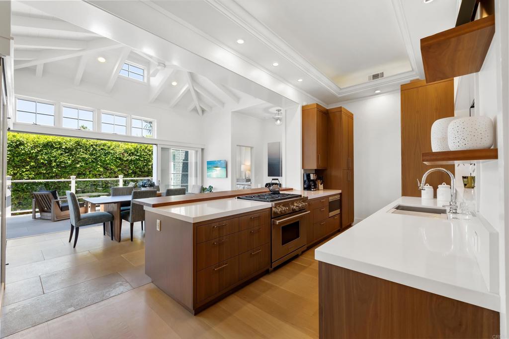 236 24th Street Del Mar, CA 92014 - Photo 8 of 44 a kitchen with stainless steel appliances granite countertop a stove and a sink