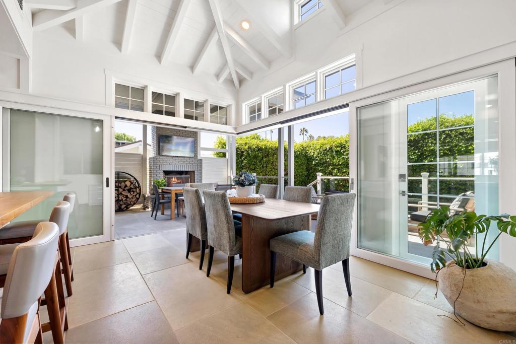 236 24th Street Del Mar, CA 92014 - Photo 10 of 44 a dining room with furniture a floor to ceiling window and potted plants
