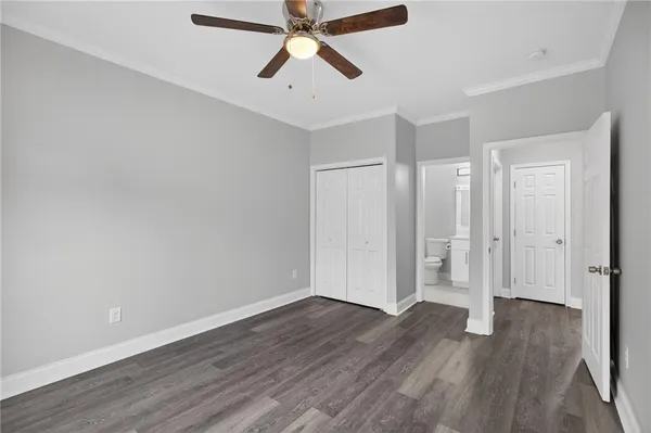 a view of an empty room and wooden floor