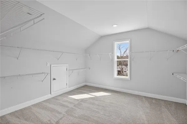an empty room with a empty space and windows
