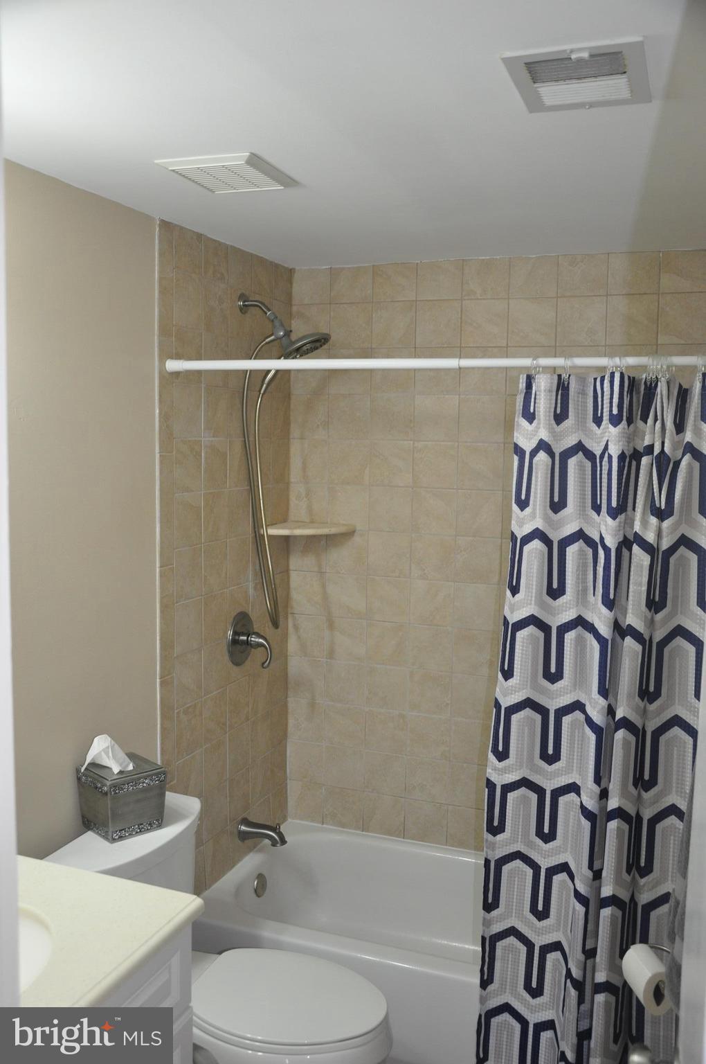 13847 Meadowbrook Road Woodbridge, VA 22193 - Photo 12 of 29 a bathroom with a toilet and a shower