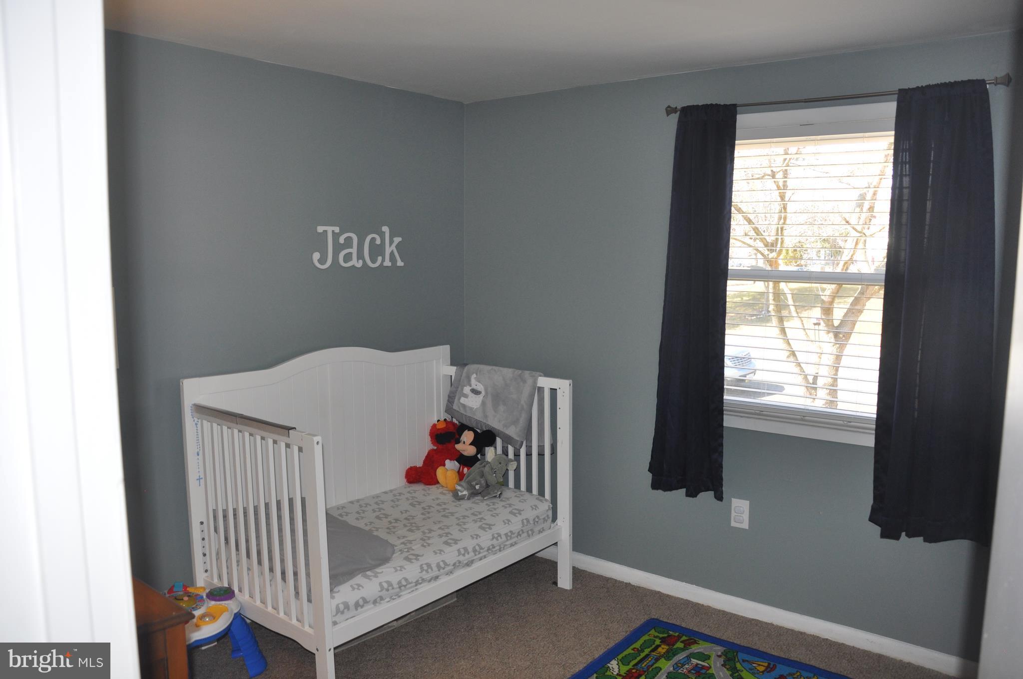 13847 Meadowbrook Road Woodbridge, VA 22193 - Photo 14 of 29 a bedroom with a bed and a window