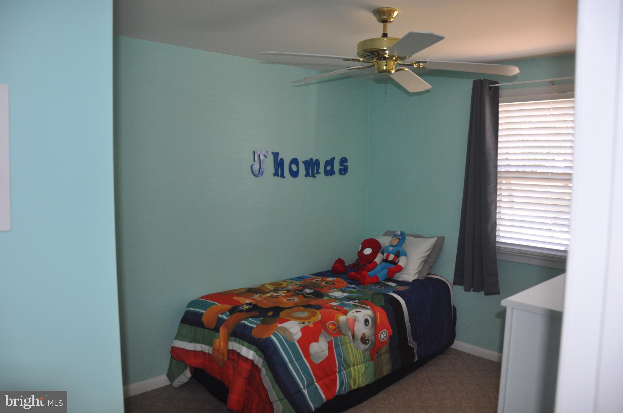 13847 Meadowbrook Road Woodbridge, VA 22193 - Photo 17 of 29 a bedroom with a bed and a chandelier