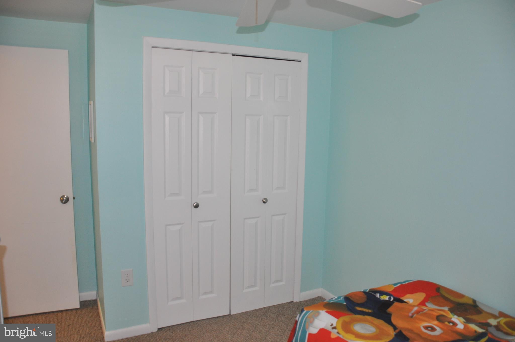 13847 Meadowbrook Road Woodbridge, VA 22193 - Photo 19 of 29 a bedroom with a bed and a lamp on the dresser