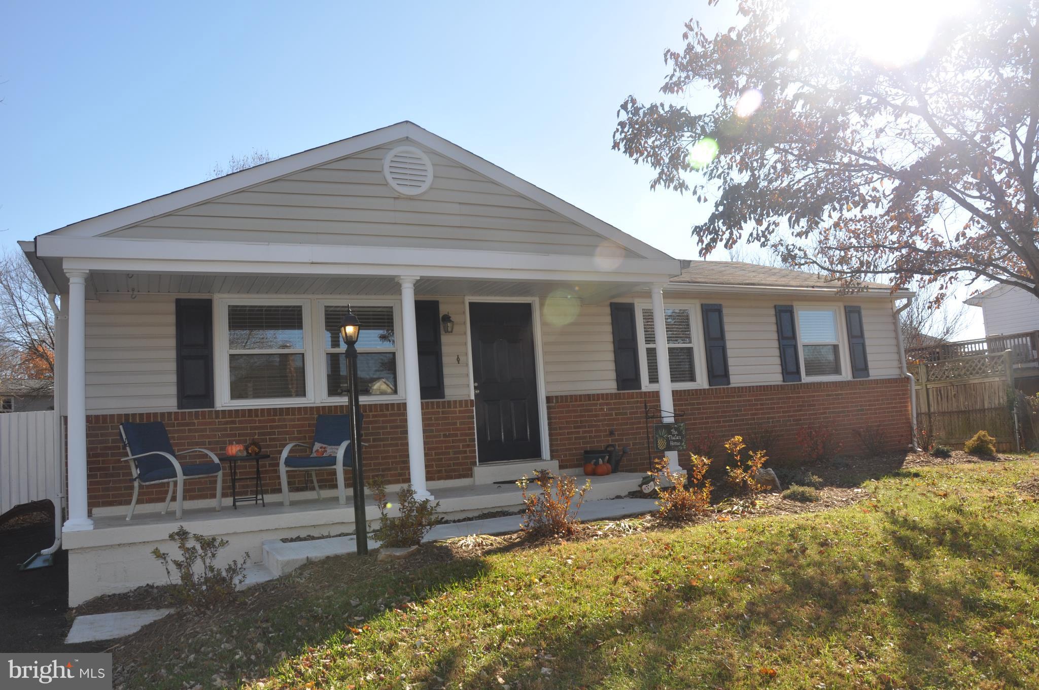 13847 Meadowbrook Road Woodbridge, VA 22193 - Photo 3 of 29 a front view of a house with yard
