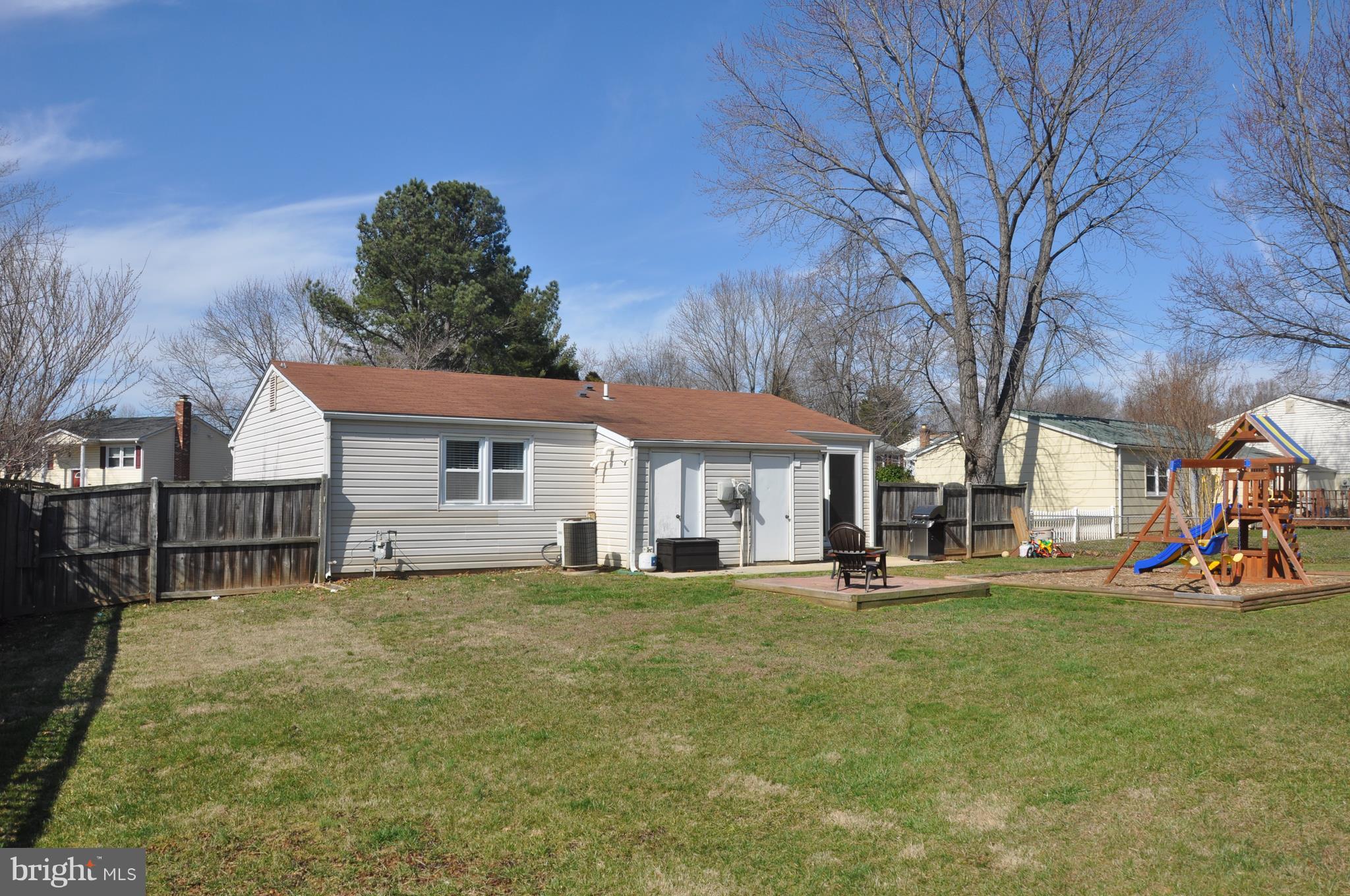13847 Meadowbrook Road Woodbridge, VA 22193 - Photo 26 of 29 a view of a house with a big yard and large tree