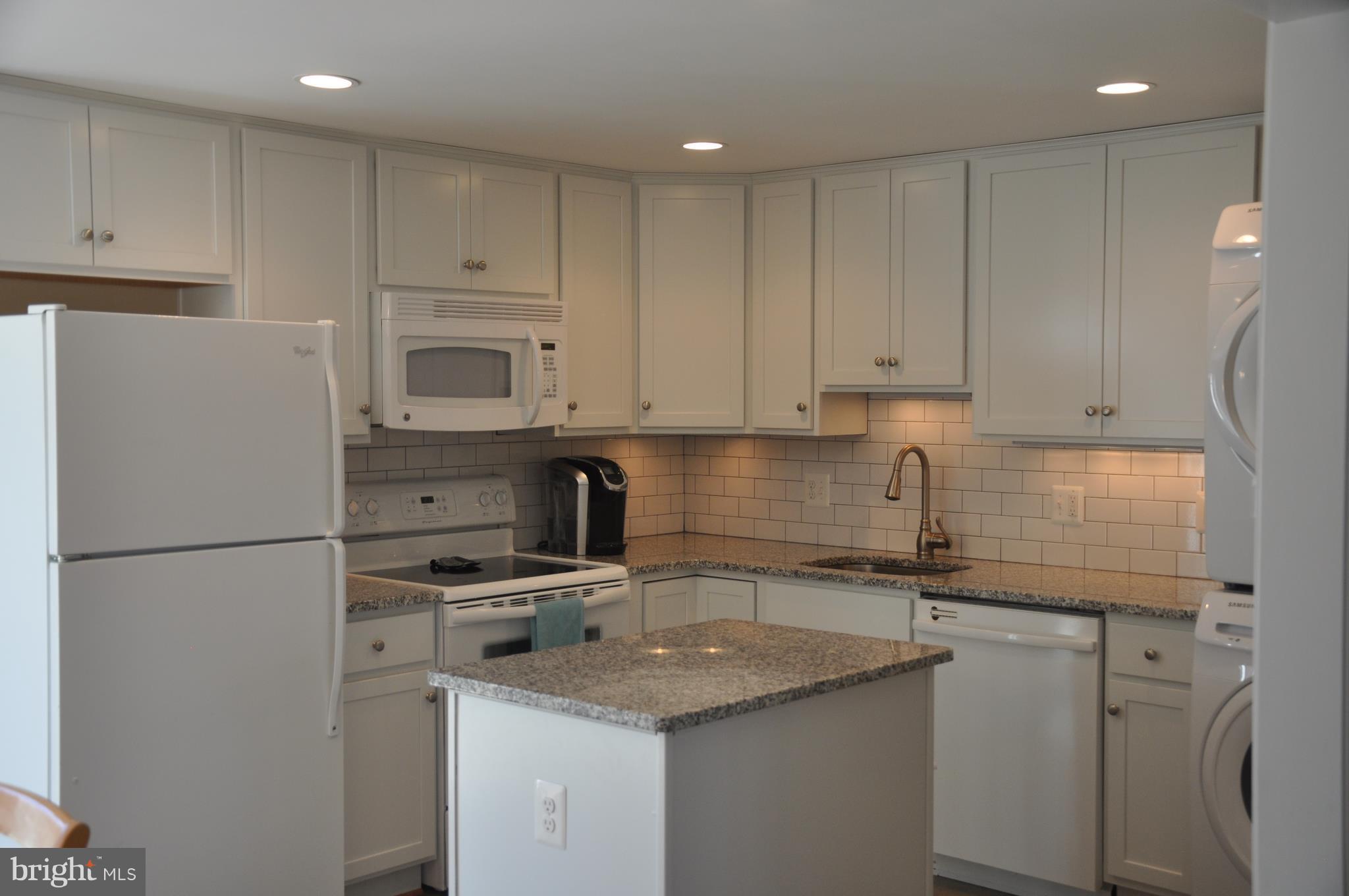 13847 Meadowbrook Road Woodbridge, VA 22193 - Photo 8 of 29 a kitchen with appliances a sink and cabinets