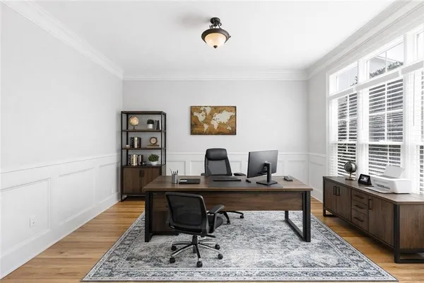 a workspace with furniture and a window