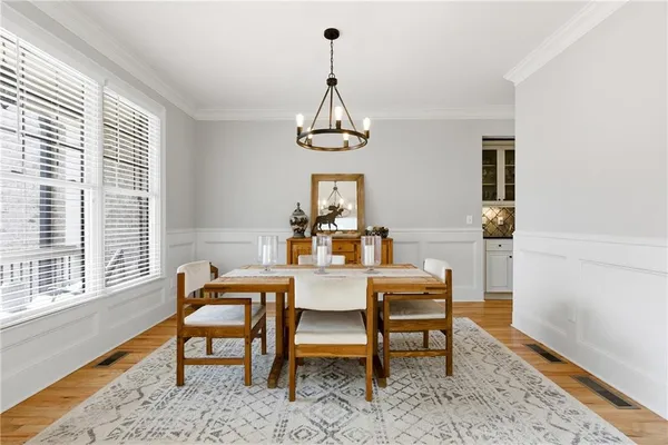 a view of a dining room with furniture window and wooden floor
