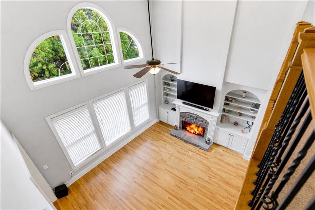 810 Ravenstone Way Canton, GA 30115 - Photo 16 of 51 a view of living room with furniture and a flat screen tv