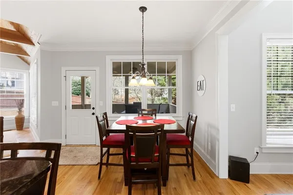 a dining room with furniture window wooden floor