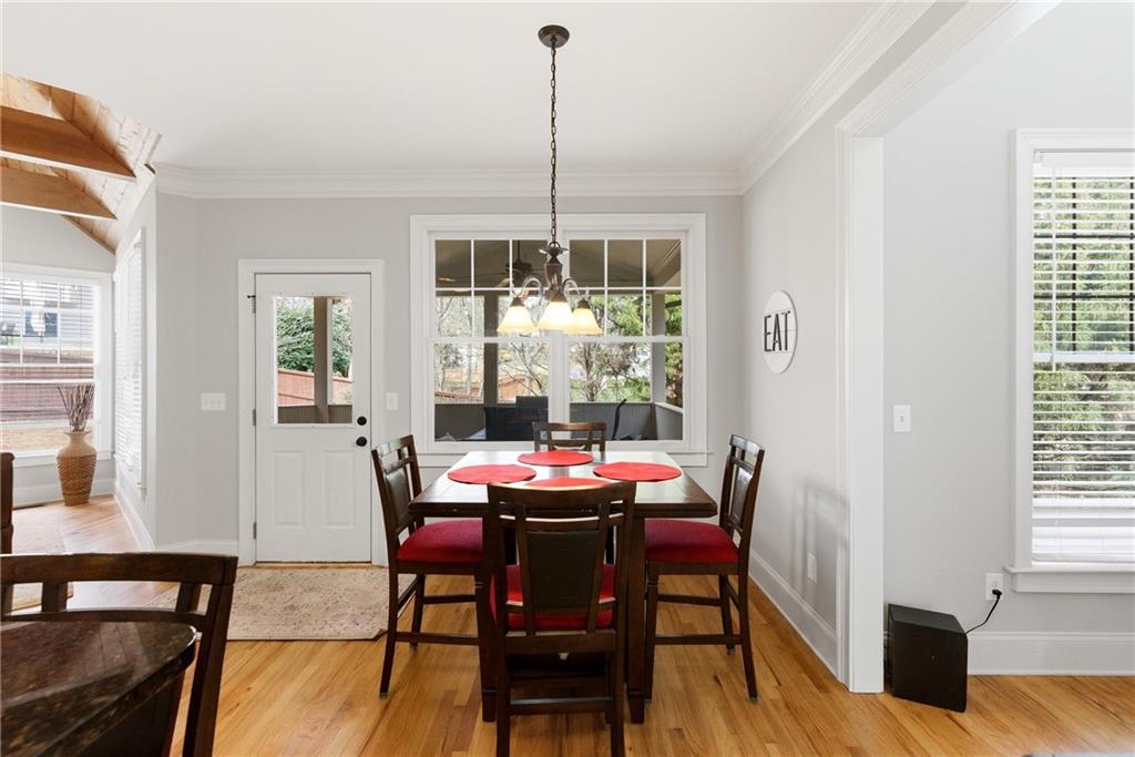 810 Ravenstone Way Canton, GA 30115 - Photo 20 of 51 a dining room with furniture window wooden floor
