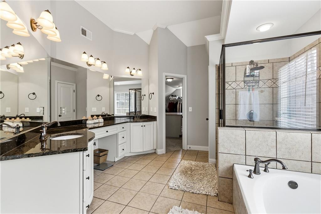 810 Ravenstone Way Canton, GA 30115 - Photo 26 of 51 a large kitchen with a sink and cabinets