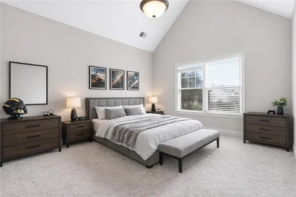 a bedroom with a bed and window
