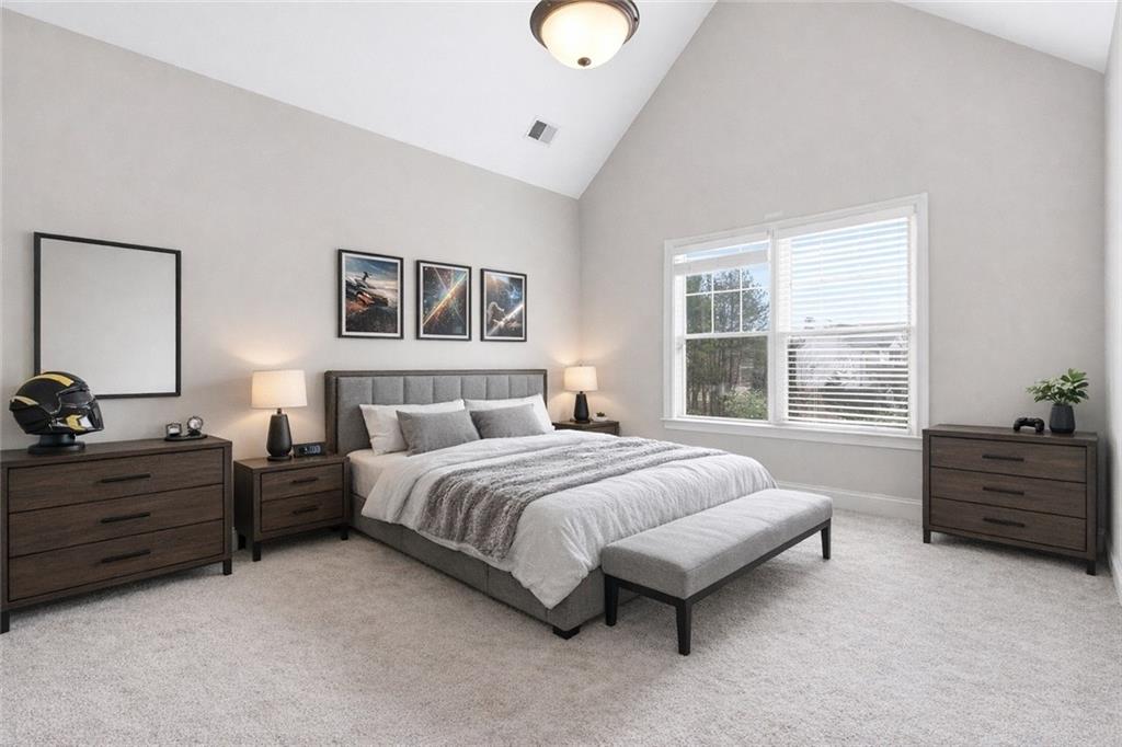 810 Ravenstone Way Canton, GA 30115 - Photo 30 of 51 a bedroom with a bed and window
