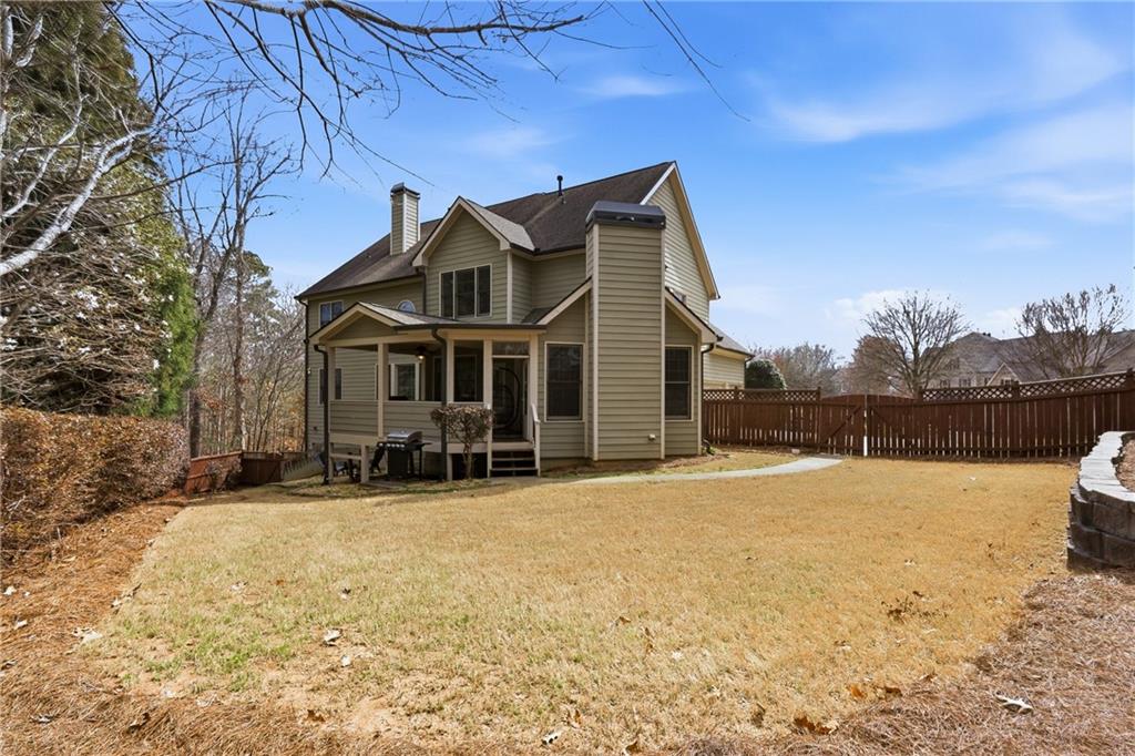810 Ravenstone Way Canton, GA 30115 - Photo 3 of 51 a front view of a house with a yard