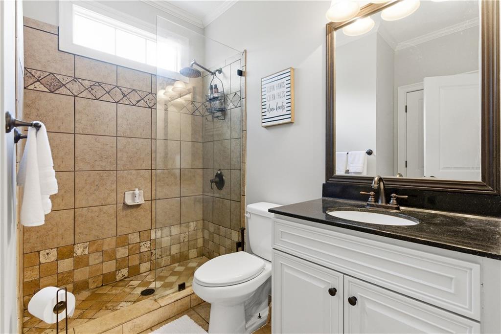 810 Ravenstone Way Canton, GA 30115 - Photo 33 of 51 a bathroom with a sink and a mirror
