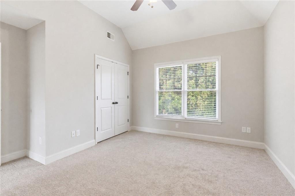 810 Ravenstone Way Canton, GA 30115 - Photo 34 of 51 an empty room with a window