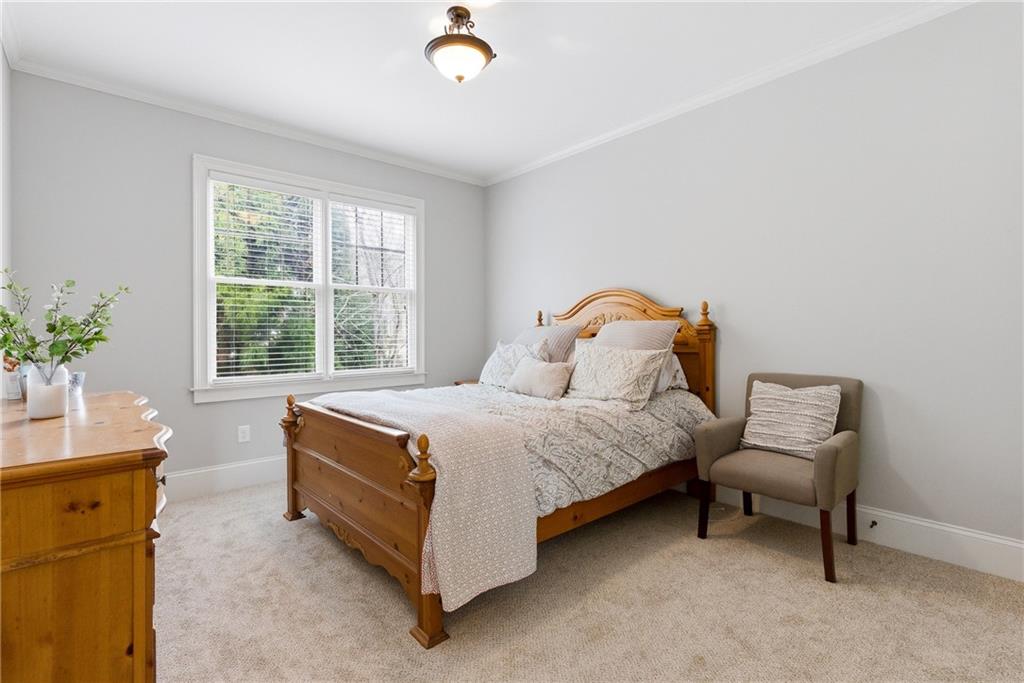 810 Ravenstone Way Canton, GA 30115 - Photo 36 of 51 a bedroom with a bed chair and a window