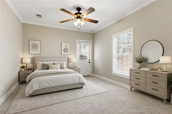 a bedroom with a bed a dresser and a window