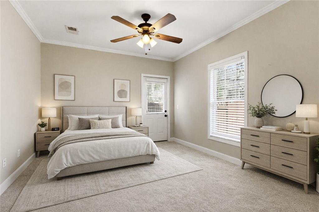 810 Ravenstone Way Canton, GA 30115 - Photo 38 of 51 a bedroom with a bed a dresser and a window