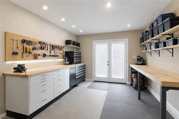a kitchen with granite countertop a sink and cabinets