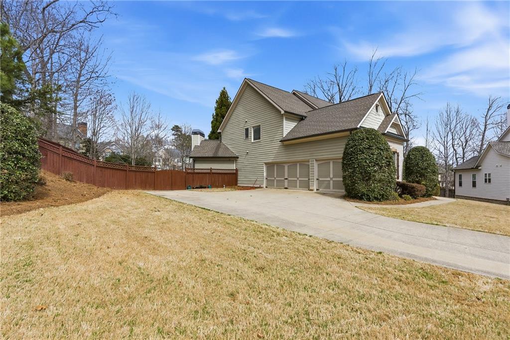 810 Ravenstone Way Canton, GA 30115 - Photo 4 of 51 a view of house with yard and covered with snow