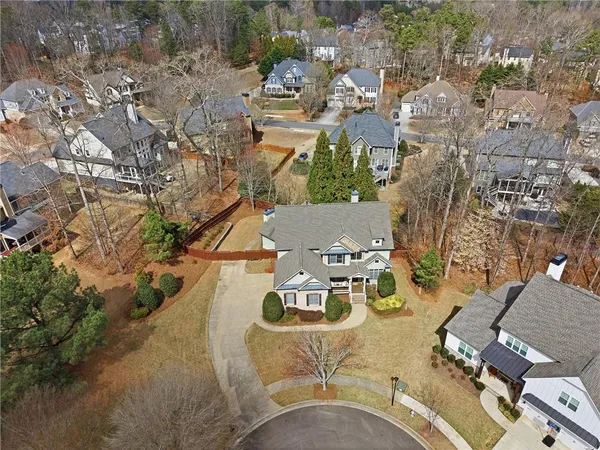 an aerial view of a house with yard swimming pool and outdoor seating