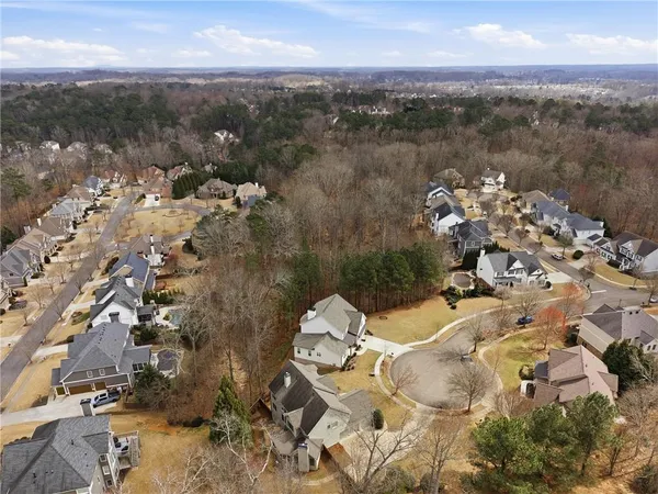 an aerial view of a house with a lake view
