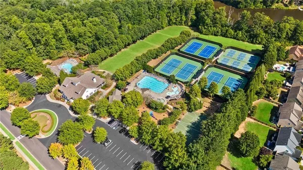 an aerial view of a swimming pool patio and outdoor seating