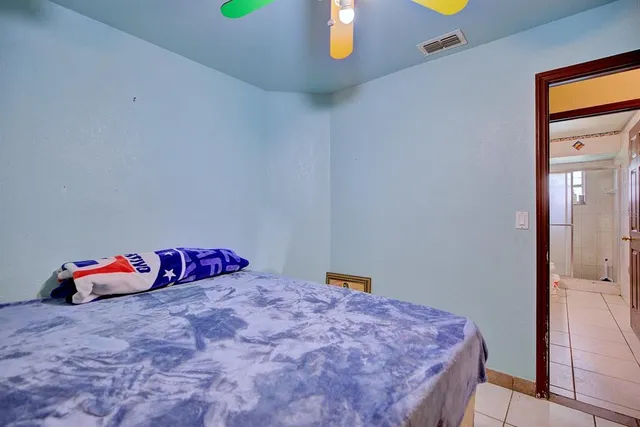 a bedroom with a bed and a dresser