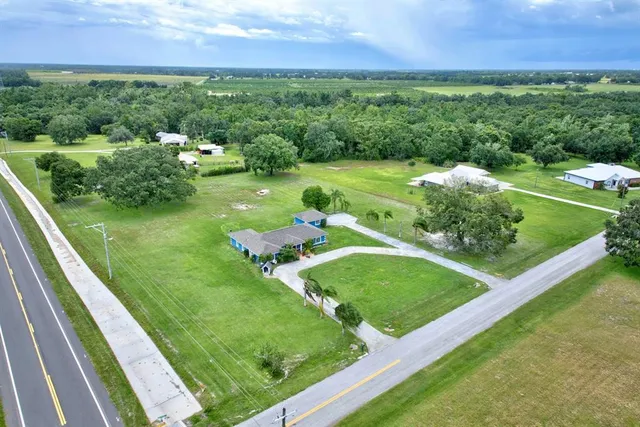 a view of a garden with a building in the background